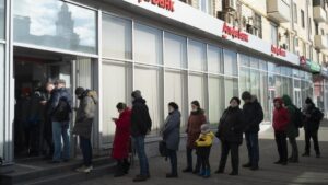 Queues at cash points as sanctions start to hit Russia